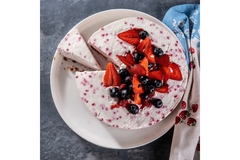Image delicious berry cheese cake with a slice partially removed and crumbs on the plate